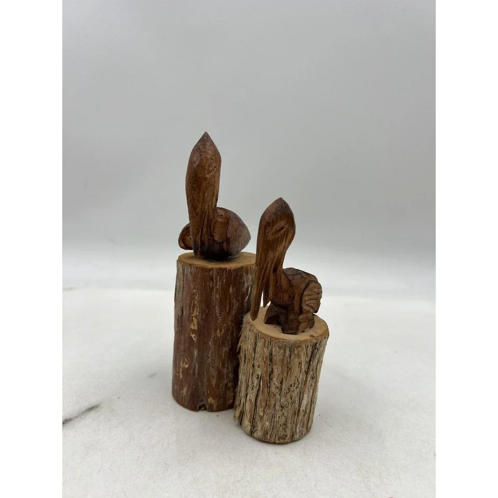 Hand Carved Wood Pelican Pair Figurines on Log Bases Rustic Coastal Folk Art
